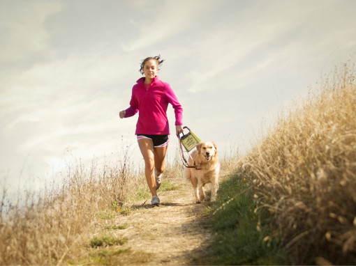 A woman run with dog